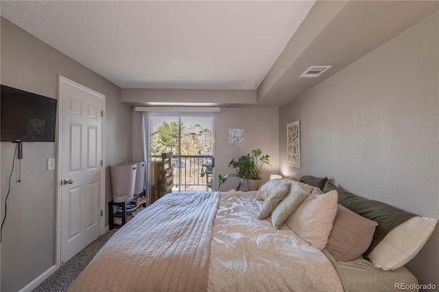 bedroom featuring visible vents, carpet flooring, and access to exterior