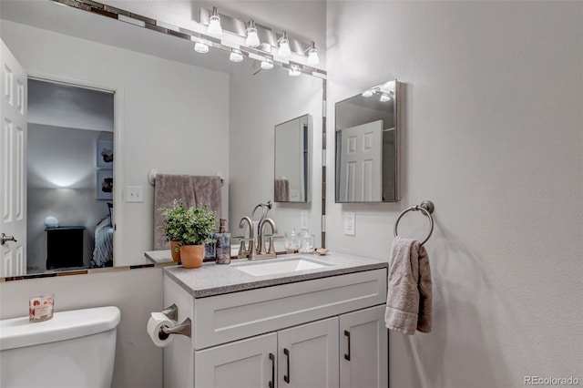 6711 S Ivy Way Unit A2, Centennial, CO 80112 - ensuite bathroom with toilet and vanity