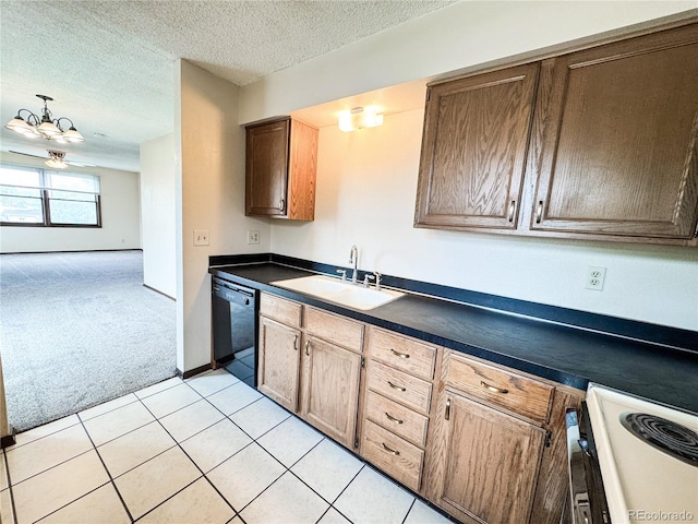 1700 S 6th Ave, Sterling, CO 80751 - kitchen featuring a sink, black dishwasher, white electric range, dark countertops, and a chandelier