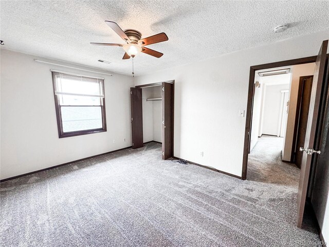 1700 S 6th Ave, Sterling, CO 80751 - unfurnished bedroom with light colored carpet, a closet, a textured ceiling, ceiling fan, and baseboards