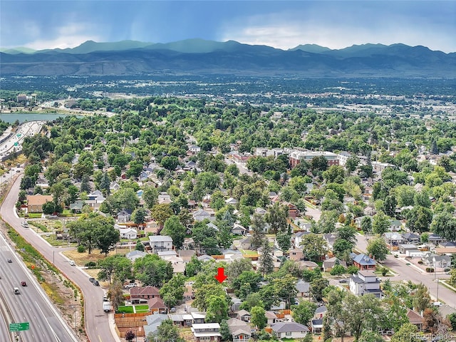 drone / aerial view with a residential view and a water and mountain view