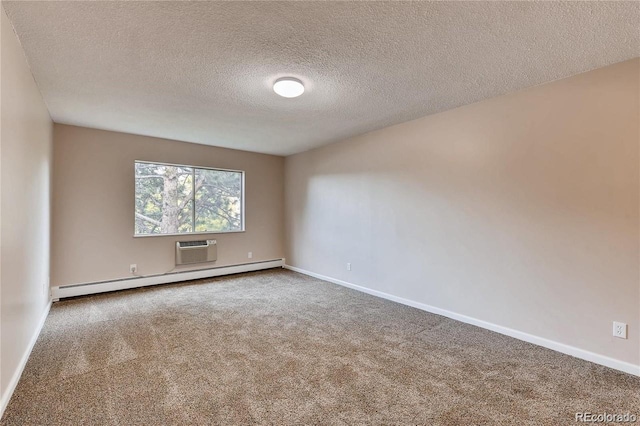 carpeted empty room featuring a textured ceiling, a baseboard heating unit, and a wall mounted AC