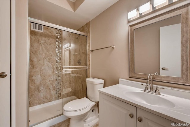 bathroom with vanity, toilet, and walk in shower