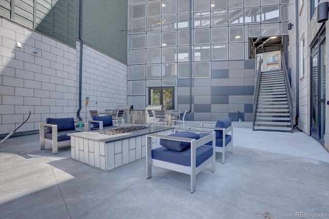 view of patio / terrace featuring an outdoor fire pit