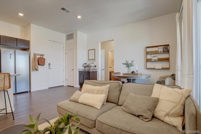 9283 Twenty Mile Rd Unit 403, Parker, CO 80134 - living room featuring dark wood finished floors and recessed lighting