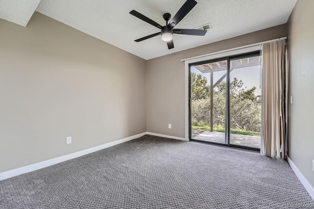 spare room featuring plenty of natural light, baseboards, a ceiling fan, and dark colored carpet