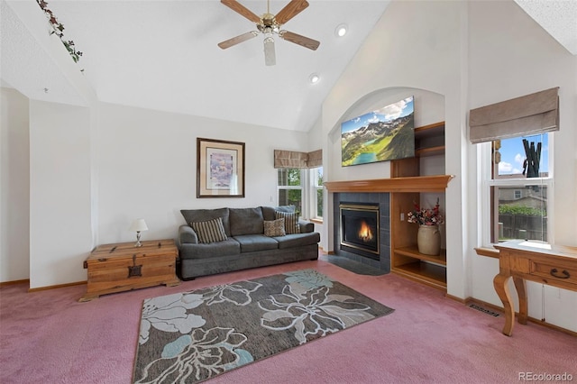 11366 Haswell Dr, Parker, CO 80134 - carpeted living room featuring ceiling fan, high vaulted ceiling, a tile fireplace, and recessed lighting