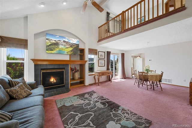 11366 Haswell Dr, Parker, CO 80134 - living room featuring high vaulted ceiling, carpet, a fireplace, and ceiling fan