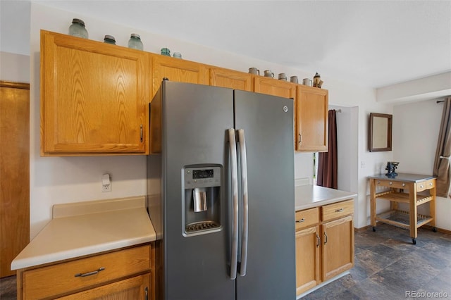11366 Haswell Dr, Parker, CO 80134 - kitchen with stainless steel fridge, light countertops, and stone finish floors