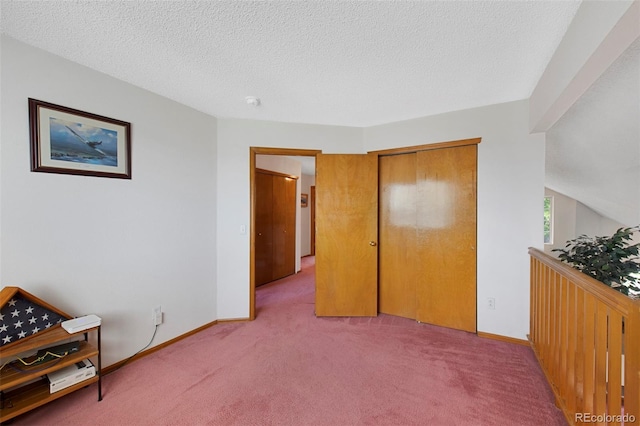11366 Haswell Dr, Parker, CO 80134 - bedroom with light colored carpet, a textured ceiling, and a closet