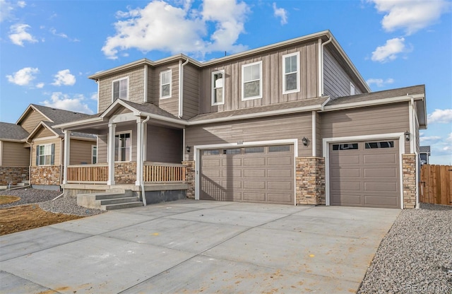 view of front of home with a porch and a garage