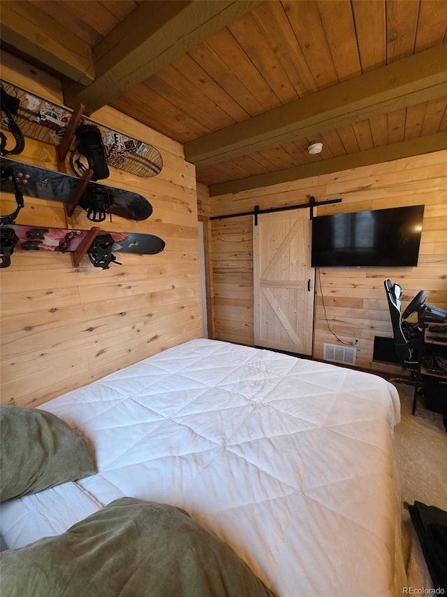 253 Bear Ln, Jefferson, CO 80456 - bedroom featuring wood walls, a barn door, and a wood ceiling with exposed beams
