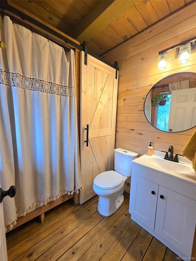 253 Bear Ln, Jefferson, CO 80456 - bathroom featuring a wood ceiling with exposed beams, wooden walls, vanity, wood-type flooring, and a shower with curtain