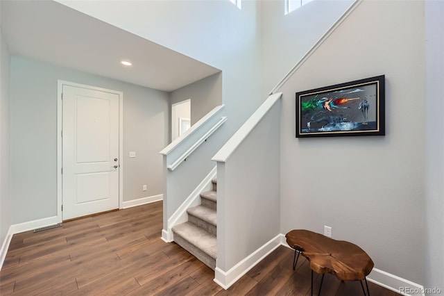 stairs with wood-type flooring