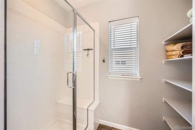 bathroom featuring an enclosed shower