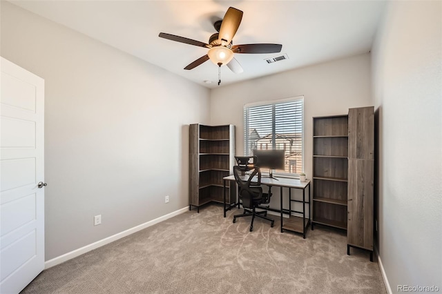 carpeted office with ceiling fan