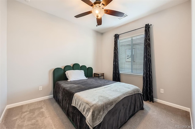 bedroom with light carpet and ceiling fan