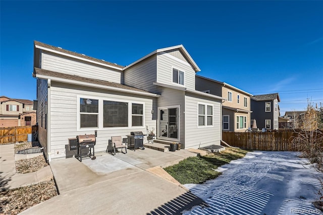 rear view of property featuring a patio area