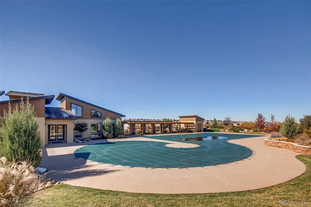 view of swimming pool with a patio area