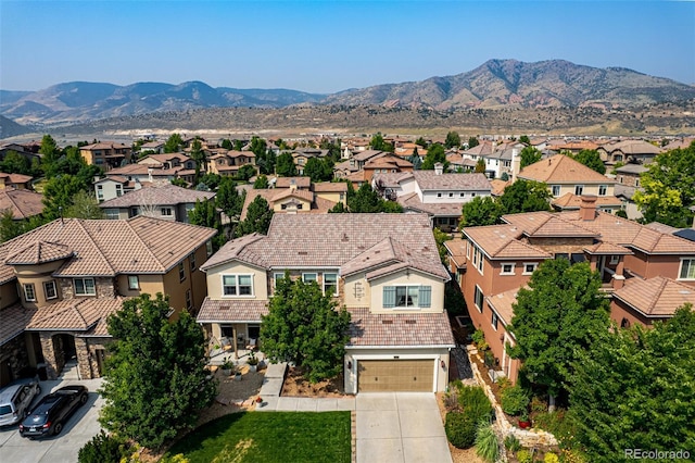 birds eye view of property with a mountain view