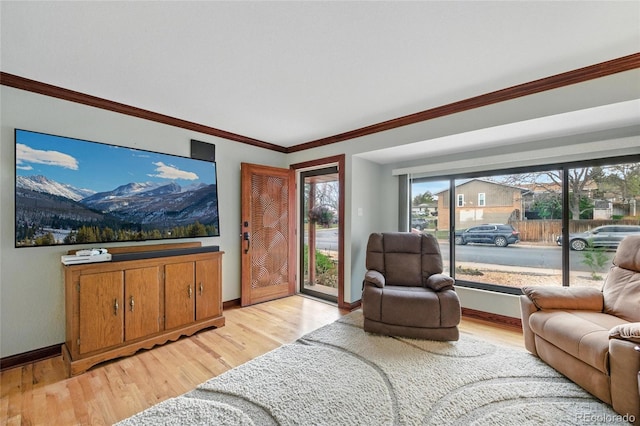 2140 S Youngfield St, Lakewood, CO 80228 - living area with baseboards, light wood finished floors, and crown molding