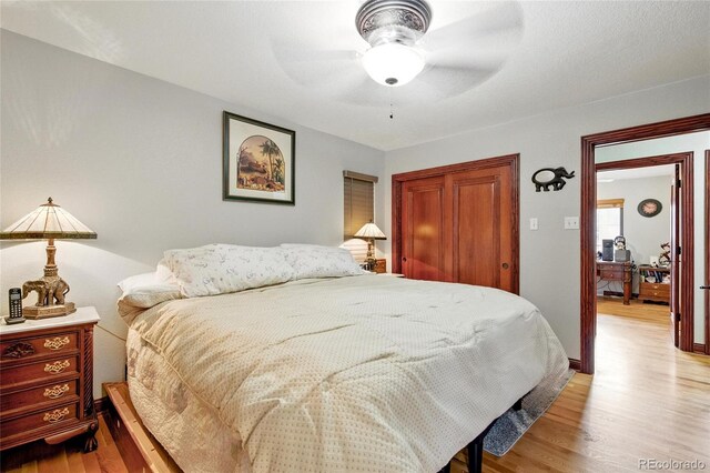2140 S Youngfield St, Lakewood, CO 80228 - bedroom with ceiling fan, a closet, and light wood finished floors