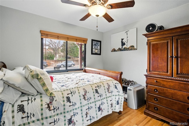 2140 S Youngfield St, Lakewood, CO 80228 - bedroom with a ceiling fan and light wood-style flooring