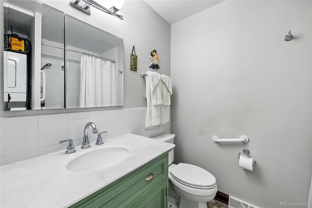 2140 S Youngfield St, Lakewood, CO 80228 - full bath with toilet, a shower with curtain, and vanity