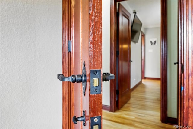 2140 S Youngfield St, Lakewood, CO 80228 - hallway with a textured wall and wood finished floors