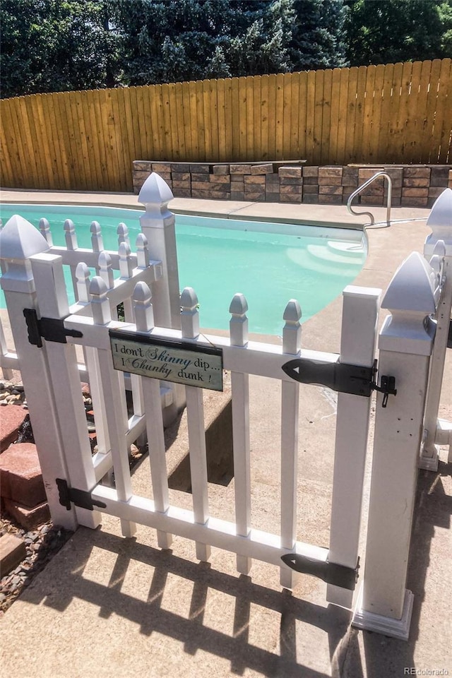 2140 S Youngfield St, Lakewood, CO 80228 - view of swimming pool with fence and a fenced in pool