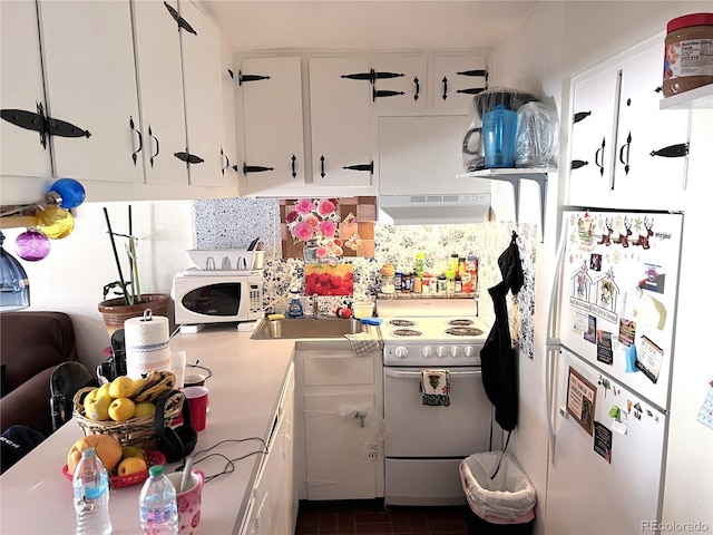 330 E Ln Bonte St Unit 2, Dillon, CO 80435 - kitchen with white appliances, exhaust hood, white cabinetry, a sink, and light countertops