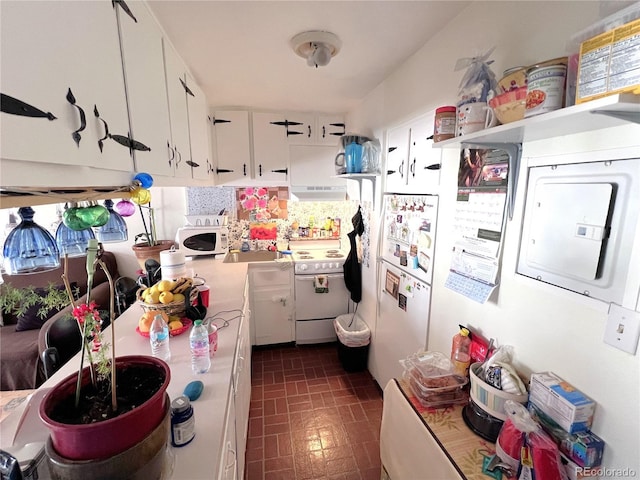 330 E Ln Bonte St Unit 2, Dillon, CO 80435 - kitchen with white appliances, extractor fan, white cabinets, brick patterned floors, and open shelves