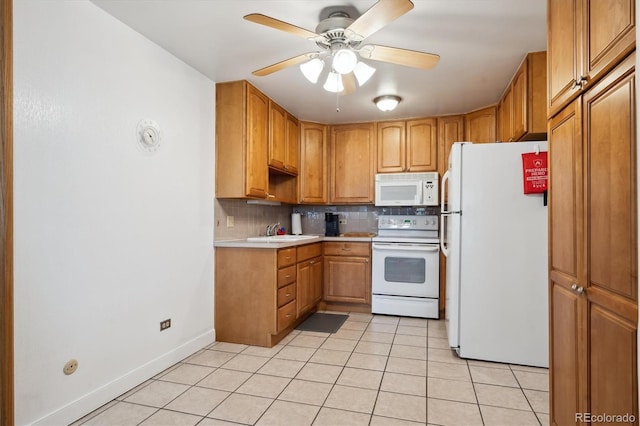 710 S Clinton St Unit 1A, Denver, CO 80247 - kitchen featuring white appliances, a sink, light tile patterned floors, tasteful backsplash, and light countertops