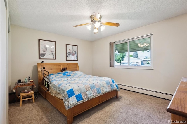 710 S Clinton St Unit 1A, Denver, CO 80247 - bedroom with a baseboard heating unit, carpet floors, a textured ceiling, and a ceiling fan