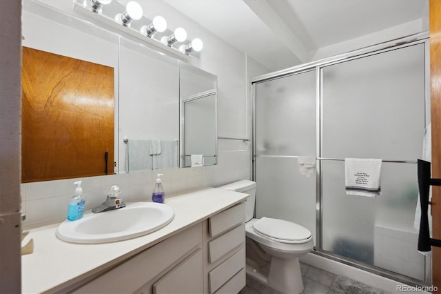 710 S Clinton St Unit 1A, Denver, CO 80247 - bathroom featuring vanity, toilet, a stall shower, backsplash, and tile patterned floors