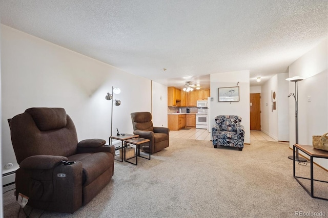 710 S Clinton St Unit 1A, Denver, CO 80247 - living area featuring light colored carpet, a textured ceiling, and a ceiling fan