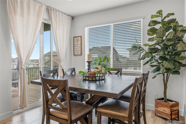 8132 Mt Harvard Rd, Littleton, CO 80125 - dining area featuring light wood-style floors and baseboards
