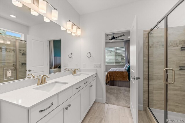 8132 Mt Harvard Rd, Littleton, CO 80125 - bathroom featuring ensuite bathroom, double vanity, healthy amount of natural light, and a stall shower