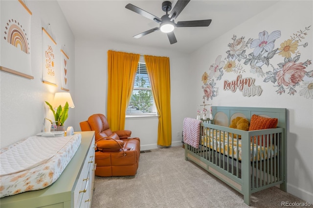 8132 Mt Harvard Rd, Littleton, CO 80125 - carpeted bedroom featuring a crib, baseboards, and a ceiling fan