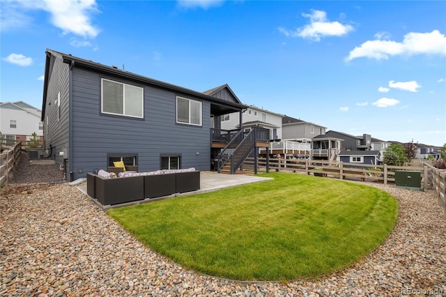 8132 Mt Harvard Rd, Littleton, CO 80125 - rear view of house with a wooden deck, outdoor lounge area, stairs, a patio area, and a residential view