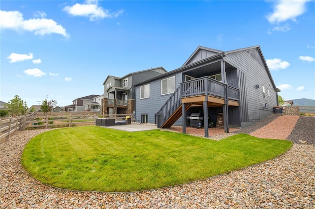 8132 Mt Harvard Rd, Littleton, CO 80125 - rear view of house with stairway, board and batten siding, a wooden deck, and a patio area