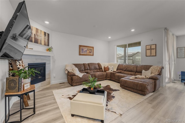 8132 Mt Harvard Rd, Littleton, CO 80125 - living room with light wood-style floors, recessed lighting, and a tiled fireplace