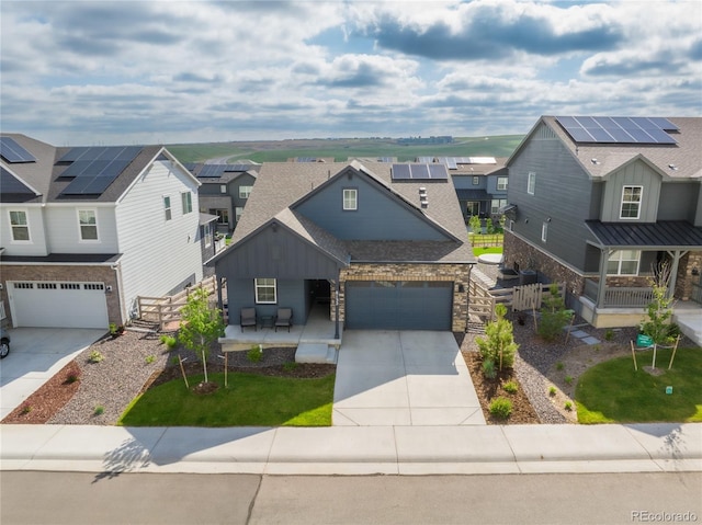 8132 Mt Harvard Rd, Littleton, CO 80125 - view of front of property with driveway, covered porch, a residential view, board and batten siding, and a shingled roof