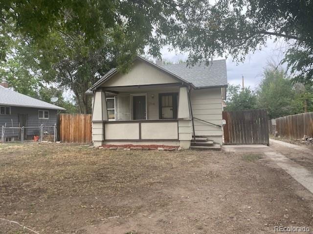 2771 W 1st Ave, Denver, CO 80219 - bungalow featuring a porch and fence