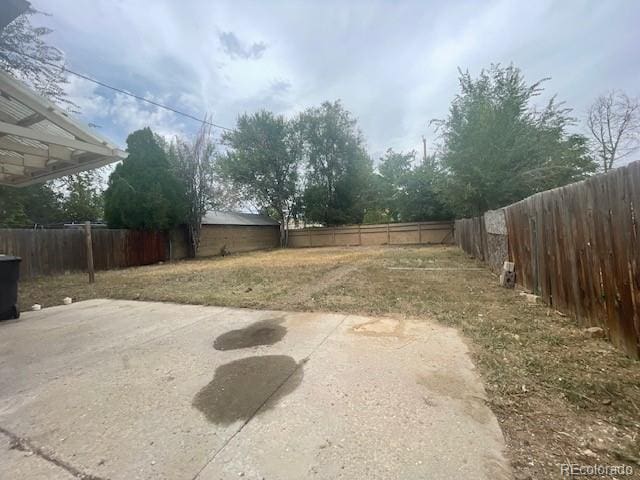 2771 W 1st Ave, Denver, CO 80219 - view of yard featuring a patio and a fenced backyard