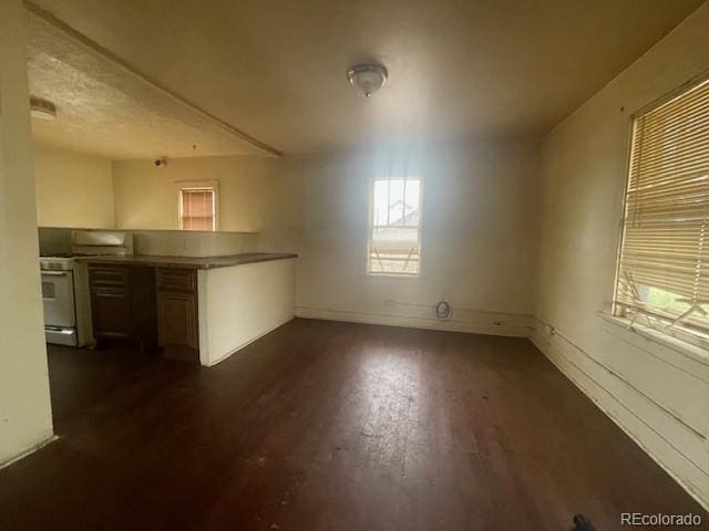 2771 W 1st Ave, Denver, CO 80219 - interior space with dark wood-type flooring and baseboards