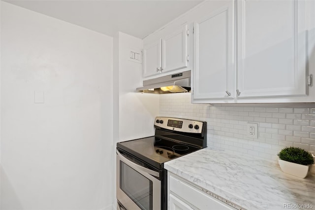 kitchen featuring decorative backsplash, white cabinetry, and stainless steel range with electric stovetop