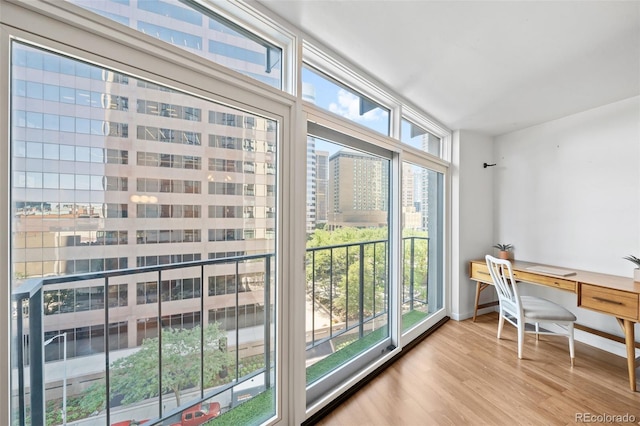 office with light hardwood / wood-style flooring