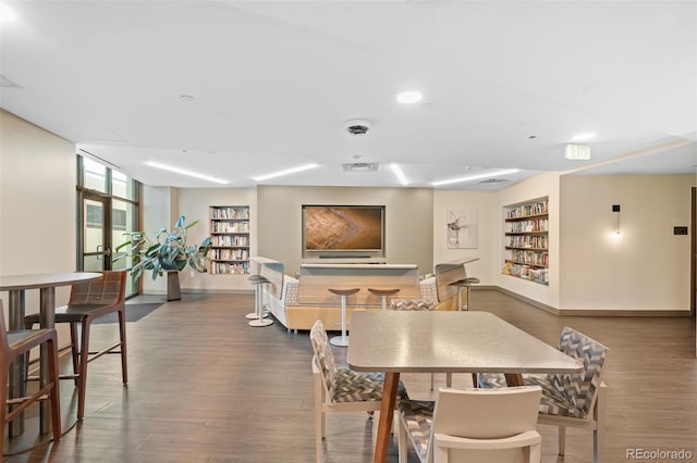 dining room with dark hardwood / wood-style flooring