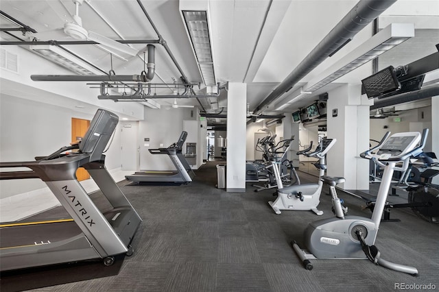 workout area with dark carpet